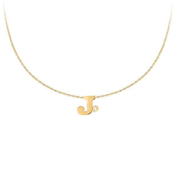 This necklace features an uppercase initial with a bezel set diamon...