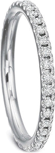 This diamond wedding band by Precision Set features prong set round...
