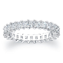 
Princess cut diamonds are set in a continuous circle using shared ...