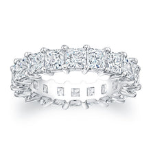
Princess cut diamonds are set in a continuous circle using shared ...