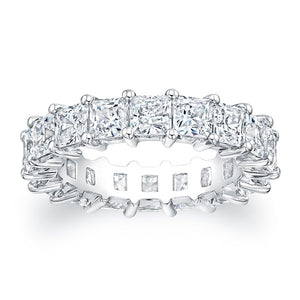 
Princess cut diamonds are set in a continuous circle using shared ...