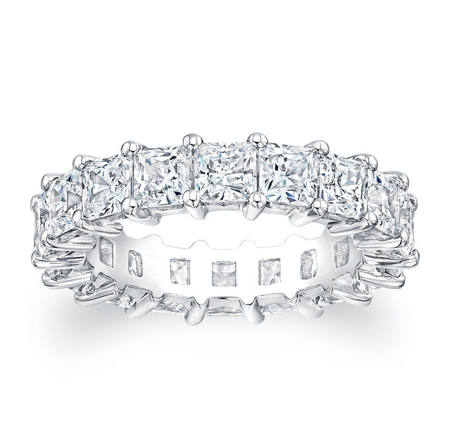 
Princess cut diamonds are set in a continuous circle using shared ...