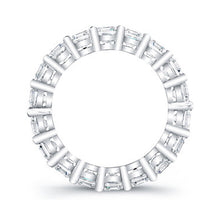 
Princess cut diamonds are set in a continuous circle using shared ...