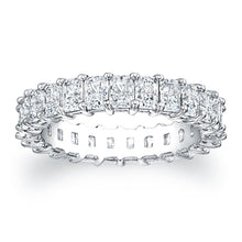 
Radiant cut diamonds are set in a continuous circle using shared p...