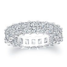 
Radiant cut diamonds are set in a continuous circle using shared p...