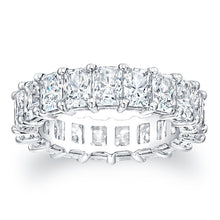
Radiant cut diamonds are set in a continuous circle using shared p...