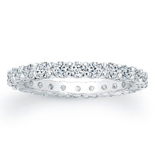 
Round brilliant cut diamonds are set in a continuous circle using ...