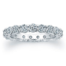 
Round brilliant cut diamonds are set in a continuous circle using ...