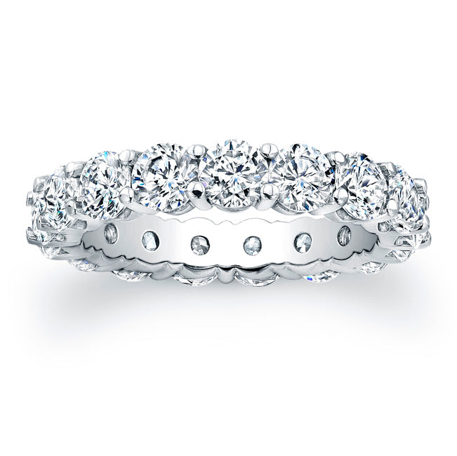 
Round brilliant cut diamonds are set in a continuous circle using ...