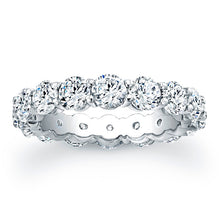 
Round brilliant cut diamonds are set in a continuous circle using ...