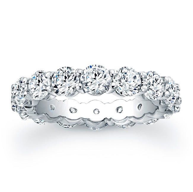 
Round brilliant cut diamonds are set in a continuous circle using ...