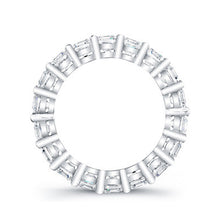 
Round brilliant cut diamonds are set in a continuous circle using ...