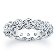
Round brilliant cut diamonds are set in a continuous circle using ...