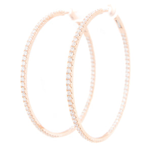 Elegant hoops featuring 140 pave-set diamonds around the inner and ...