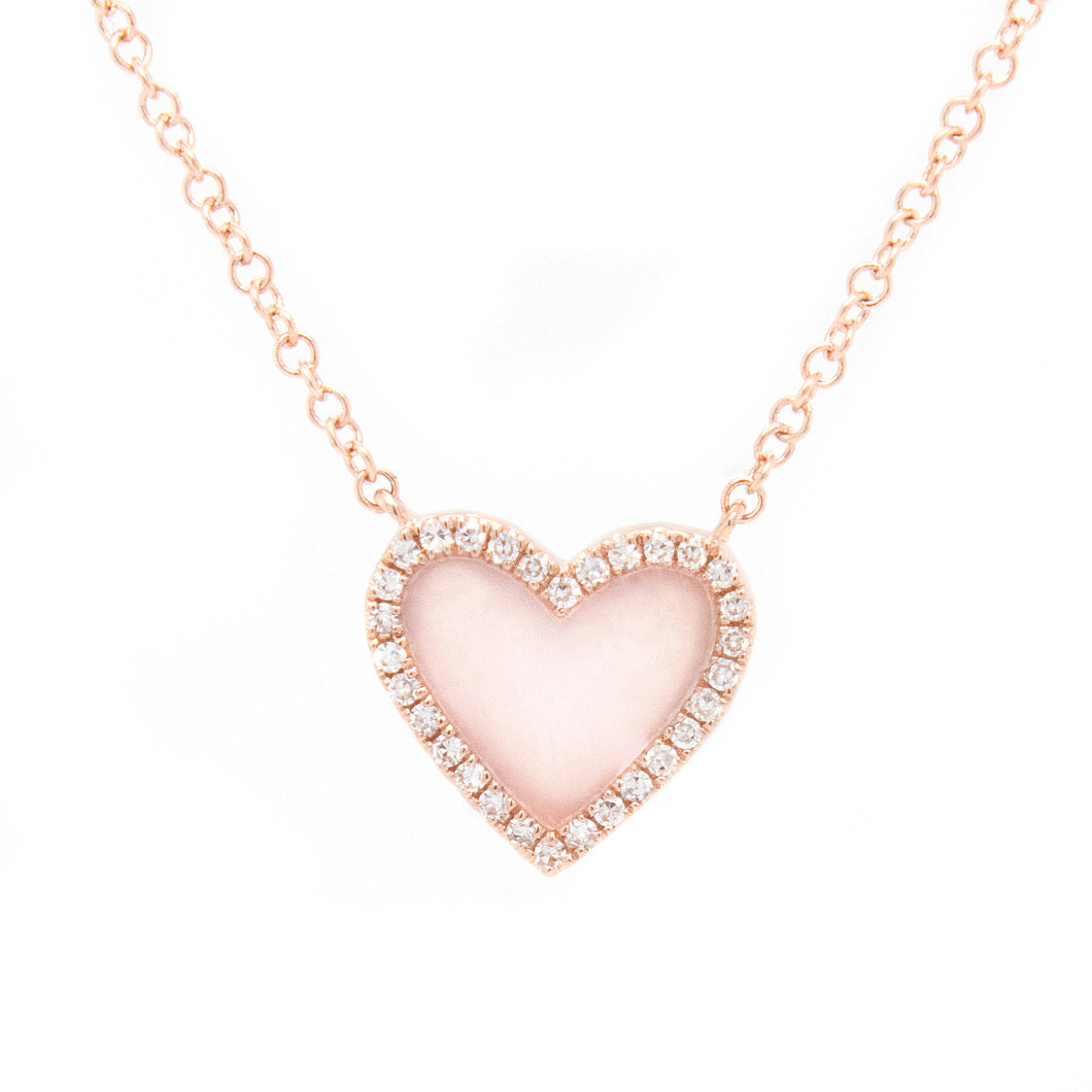 This sweet 14k rose gold necklace features a mother of pearl heart ...
