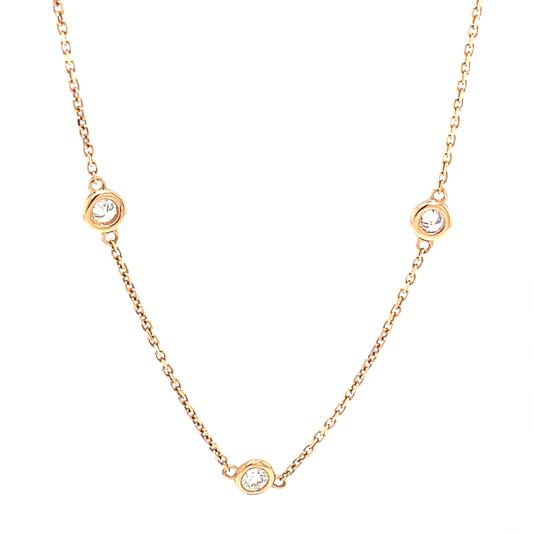 This necklace features 9, bezel-set round brilliant cut diamonds to...