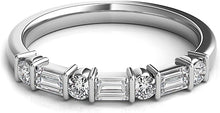 Alternating round and baguette diamonds are bar set in this classic...