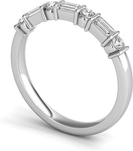 Alternating round and baguette diamonds are bar set in this classic...