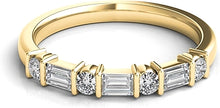 Alternating round and baguette diamonds are bar set in this classic...