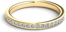 A single line of round brilliant cut diamonds are pave-set and go h...