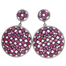 These vintage inspired sterling silver drop earrings feature rubies...