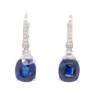 These drop earrings feature 2 trapezoid cut diamonds totaling .27ct...