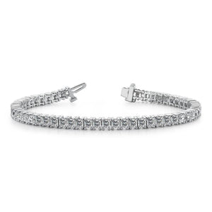 This tennis bracelet features princess cut diamonds that total 9.35...