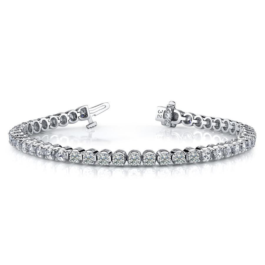 This tennis bracelet features round brilliant cut diamonds that tot...