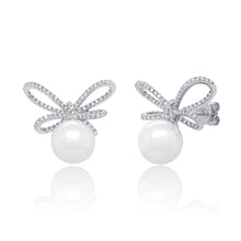 These earrings feature round brilliant cut diamonds that total .47c...