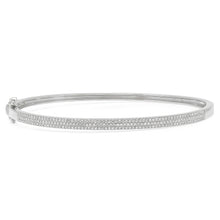 This bangle features pave set round brilliant cut diamonds that tot...