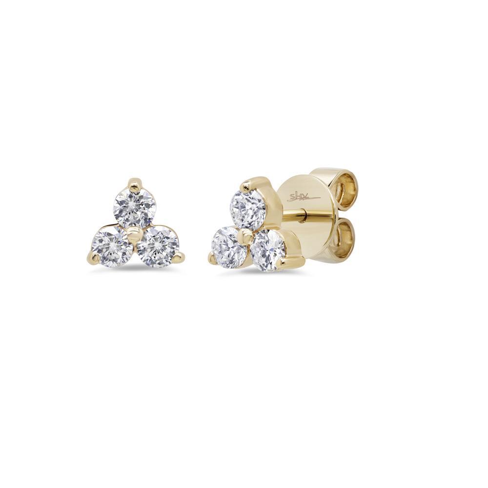 These earrings feature six round brilliant cut diamonds that total ...
