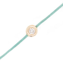 This bracelet features a bezel set round brilliant cut diamond that...