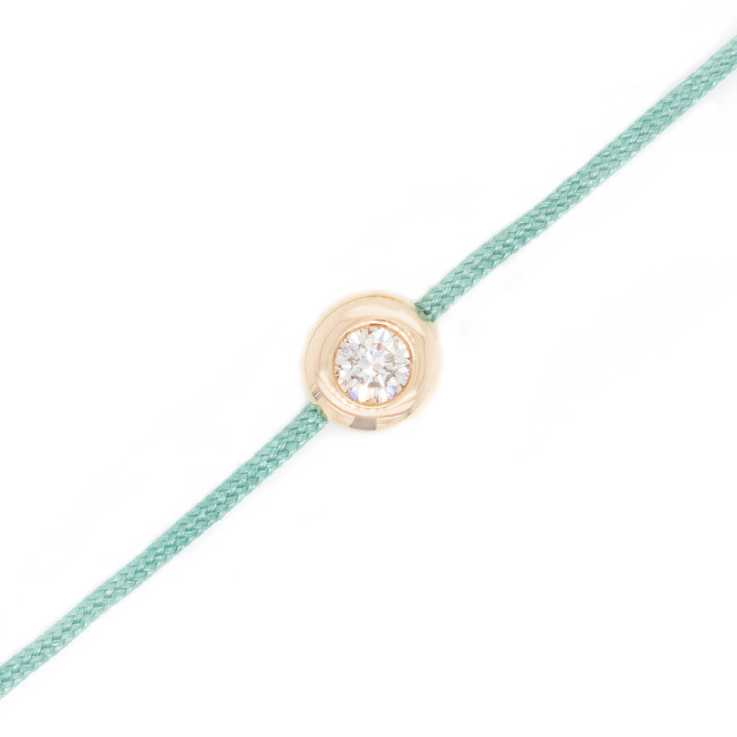 This bracelet features a bezel set round brilliant cut diamond that...