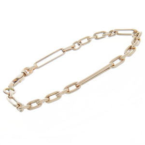 This 14k yellow gold bracelet features short and long alternating c...