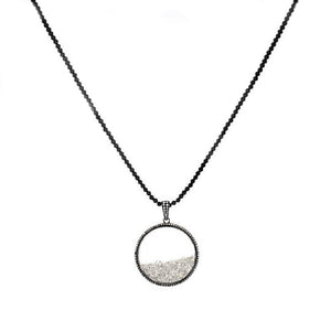 This necklace features a pendant with loose rough cut diamonds with...