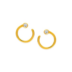 These diamond earrings feature two bezel set diamonds that total .0...