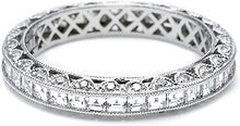 The platinum and diamond eternity band is pictured with square emer...
