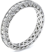 The platinum and diamond eternity band is pictured with square emer...
