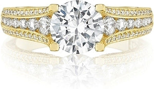 An unforgettable yellow gold engagement ring with contemporary flai...