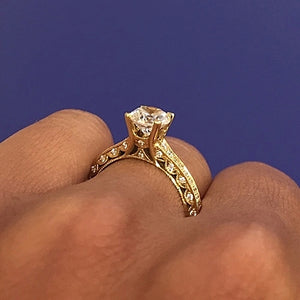 This classic pave engagement ring setting by Tacori is crafted by h...