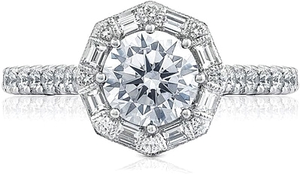 A truly regal engagement ring, this beauty features an art deco blo...