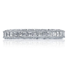 The platinum and diamond eternity band is pictured with square emer...
