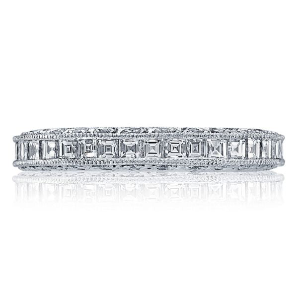 The platinum and diamond eternity band is pictured with square emer...