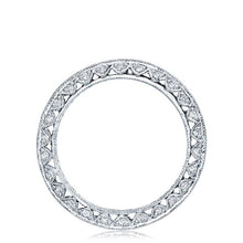 The platinum and diamond eternity band is pictured with square emer...