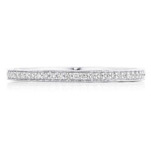 This diamond band features pave set round brilliant cut diamonds th...