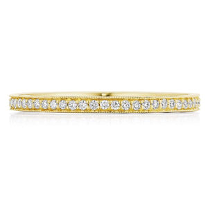 This diamond band features pave set round brilliant cut diamonds th...