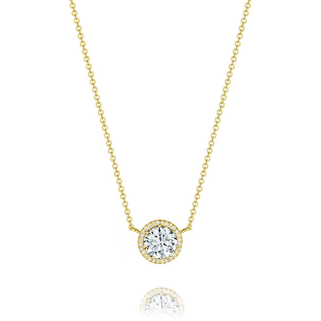A crown of pave set diamonds encircles and blooms the perfect round...