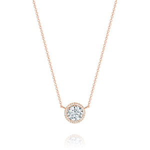 A crown of pave set diamonds encircles and blooms the perfect round...