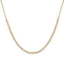 This 14k yellow gold necklace features round brilliant cut diamonds...