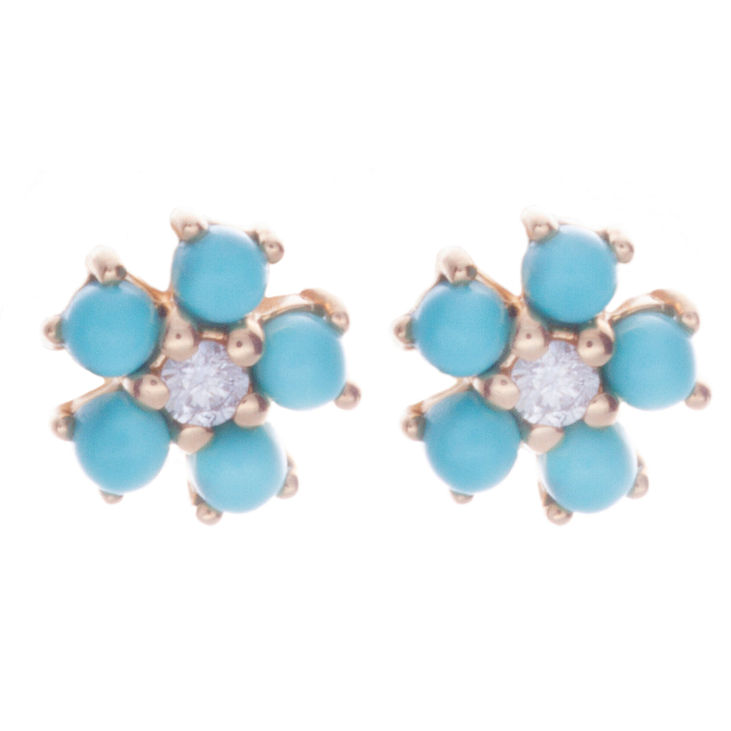 mini flower studs with center diamonds totaling .02ct and 5 surroun...